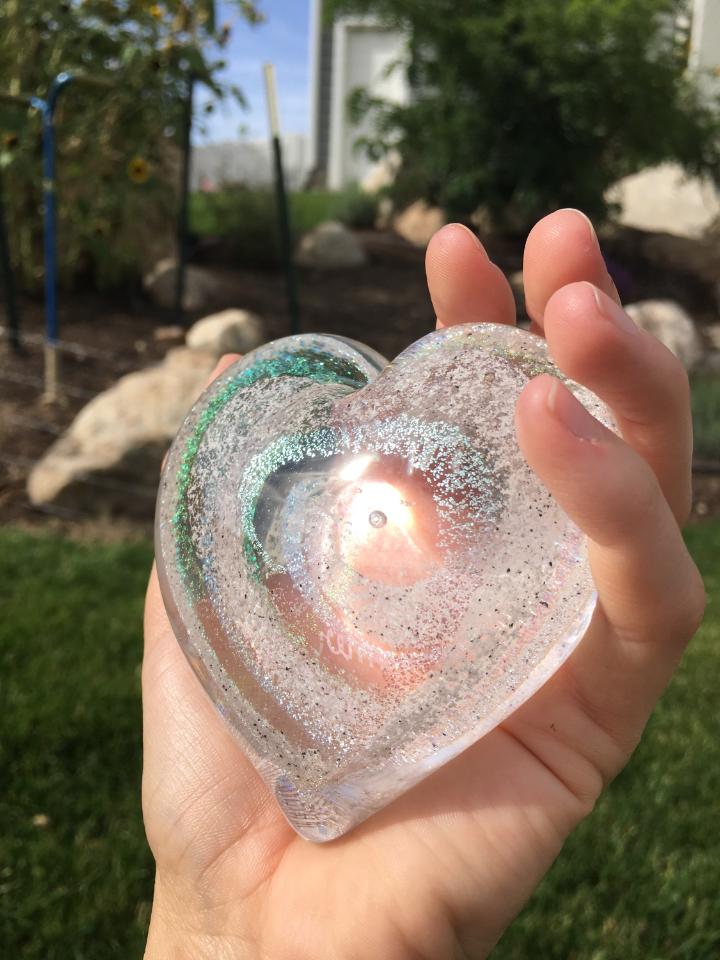 Summer's ashes in glass heart
